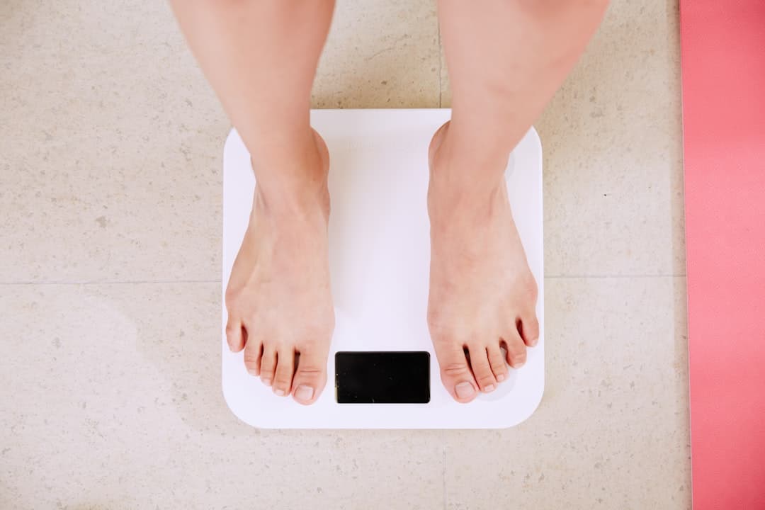 A person standing on a digital bathroom scale