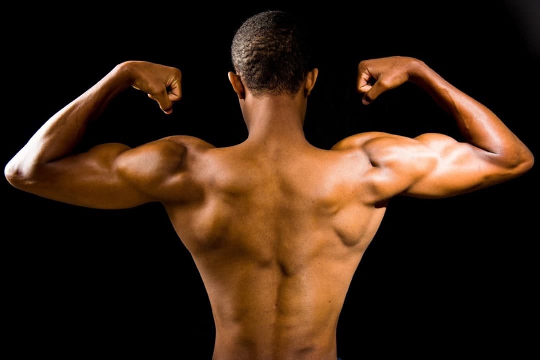 A muscular man on a dark background