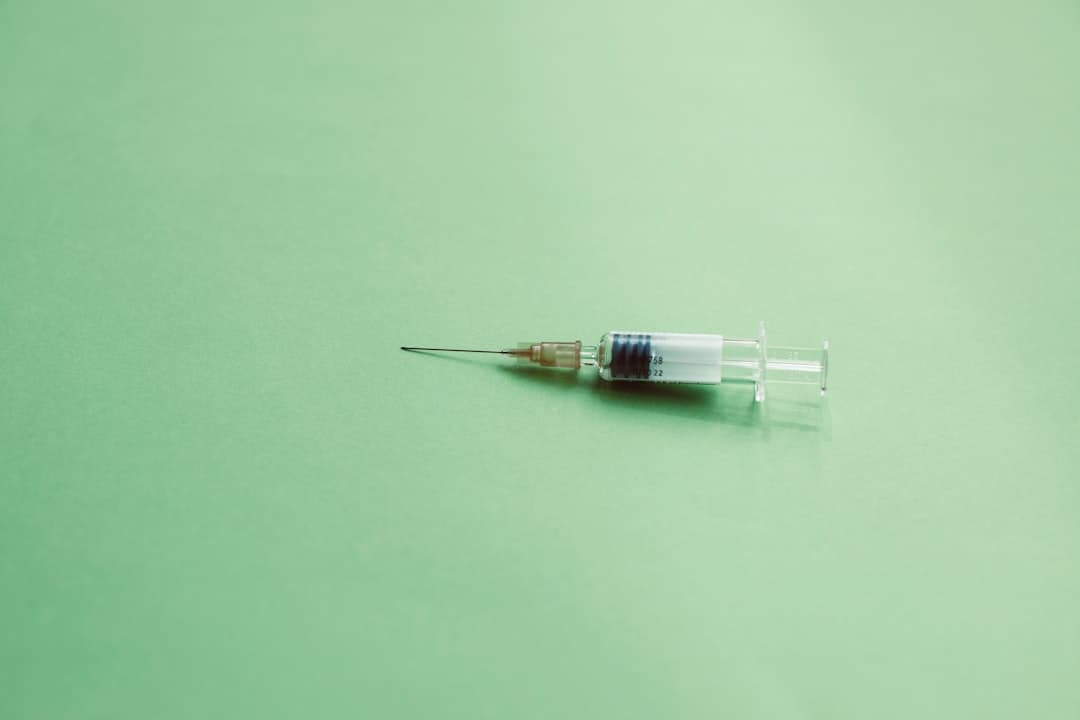 A clear plastic medical syringe