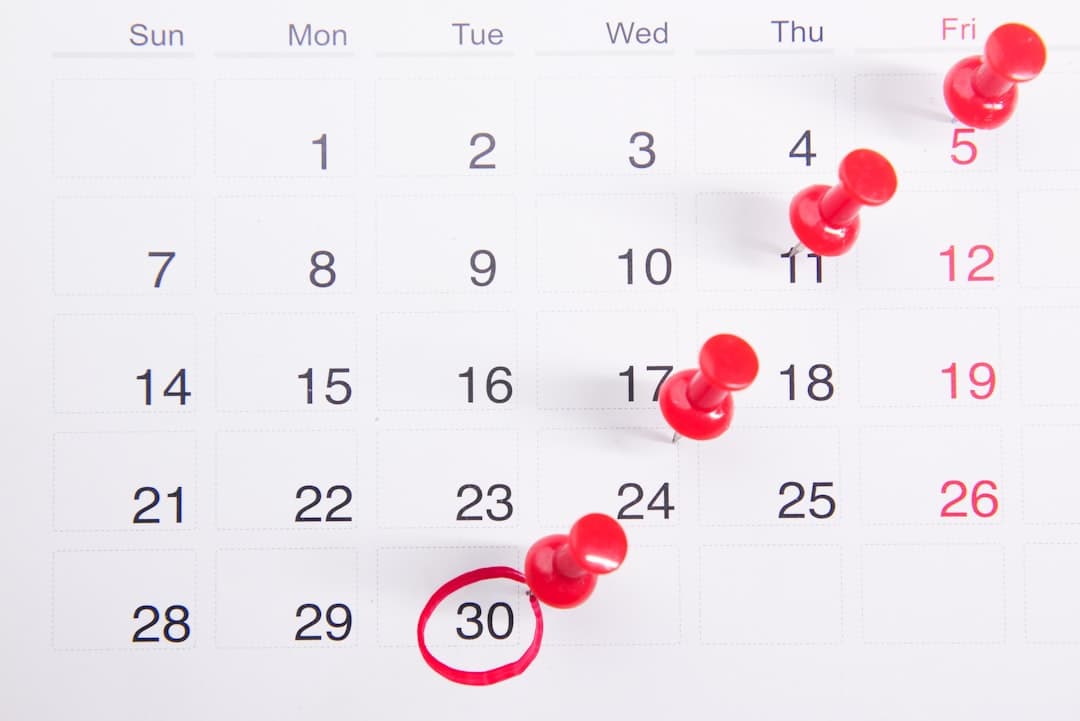 A calendar with red push buttons