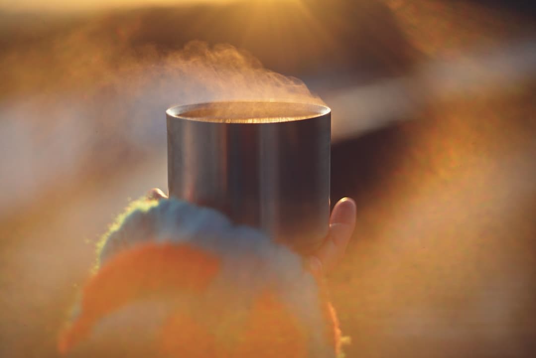 A person holding a warm cup