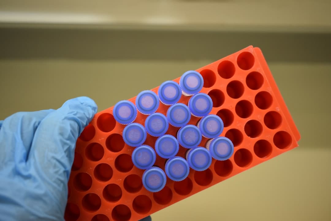 A gloved researcher hand holding laboratory material