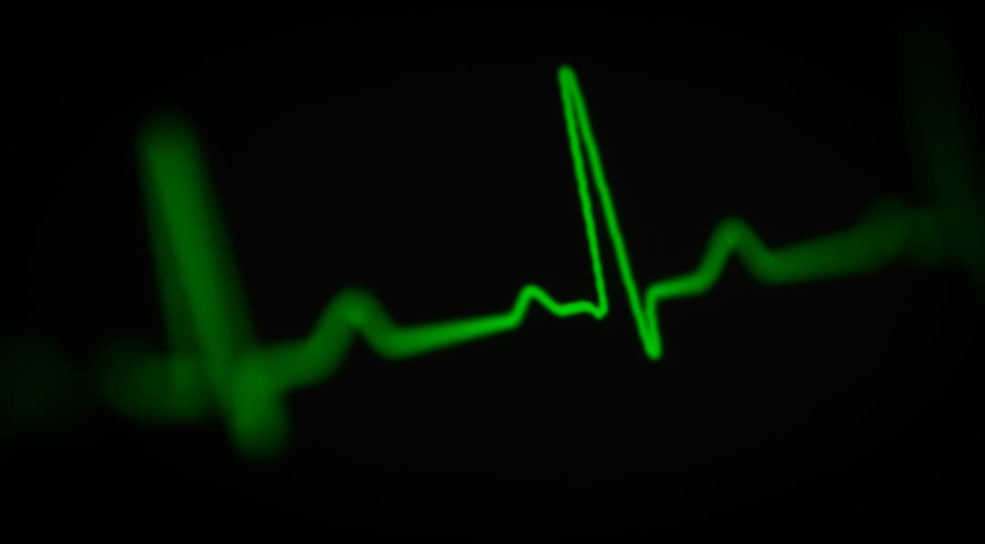 A green heart-rate waveform on a black background