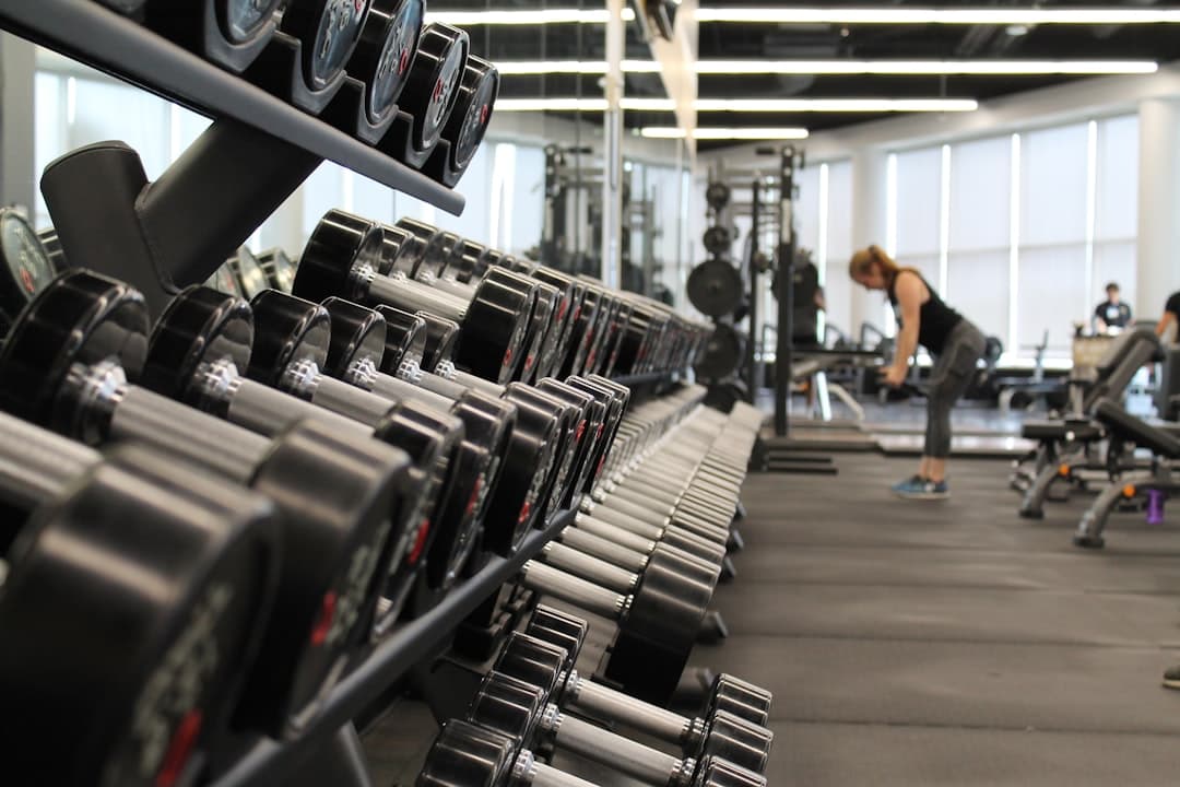 Person training surrounded by exercise equipment